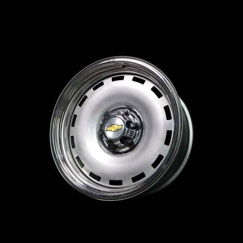 A white and chrome rim with a yellow dot on it.