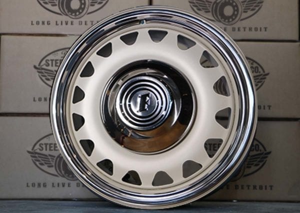 A white and chrome rim with a silver center.