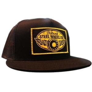 A brown hat with a yellow patch on it